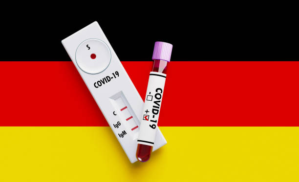 istock COVID-19 Test Tube and Test Kit Sitting on German Flag 1216033737