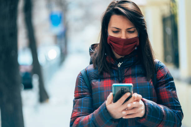 istock Woman with face protective mask 1216034380