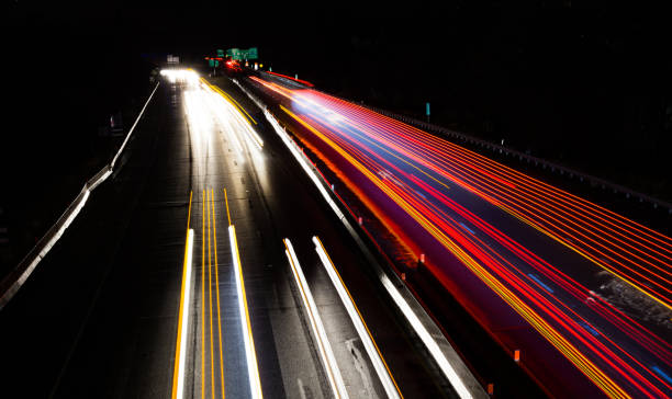 istock Night Scene Long Exposure Car Lights Highway Motion Blur 1216034405