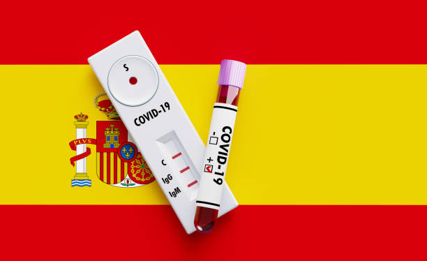 istock COVID-19 Test Tube and Test Kit Sitting on Spanish Flag 1216034430