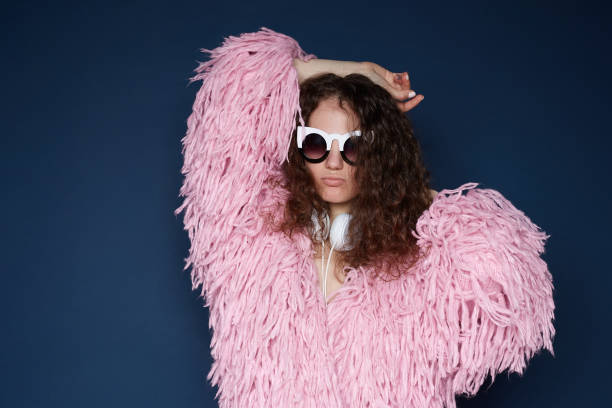 istock Fashionable woman dancing in studio 1216034463