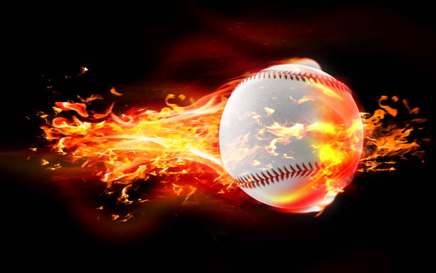 istock Baseball Ball is Burning in Flames Against Black Background 1216035846