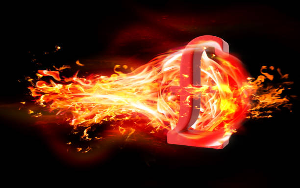 istock Pound Symbol is Burning in Flames Against Black Background 1216036021