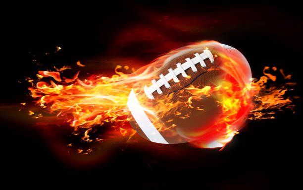 istock Rugby Ball is Burning in Flames Against Black Background 1216036603