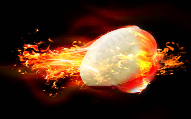 istock Rugby Ball is Burning in Flames Against Black Background 1216036653