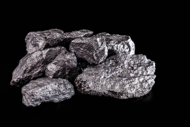 istock large silver nugget on black background. Raw silver stone, silver nugget native to Liberia, isolated on black background. Mineral extraction. 1216037045