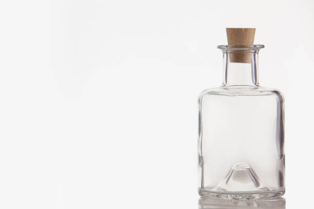 istock Beautiful transparent bottle with  cap isolated on white background 1216037162