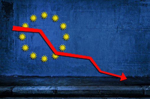 European flag background with coronavirus icons instead of the yellow stars and red downtrend arrow. Concept of european economic crisis.