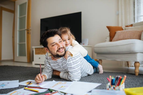 istock Young dad have fun drawing with little daughter 1216041755