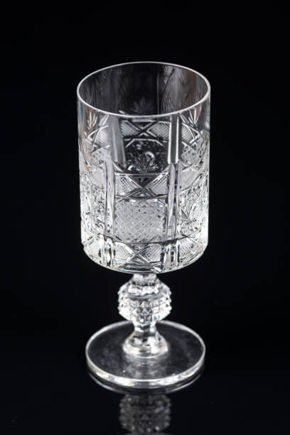 istock Crystal glass on a black background with reflections 1216044495