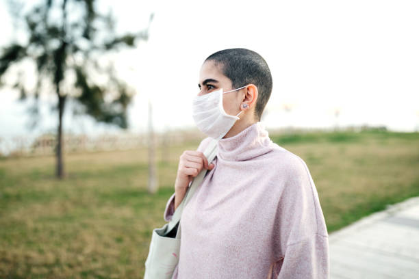 Woman wearing mask to avoid infectious diseases Woman wearing mask to avoid infectious diseases coughing photos stock pictures, royalty-free photos & images