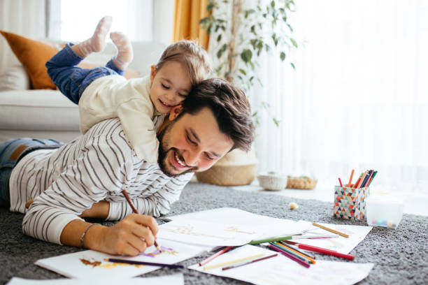 istock Young dad have fun drawing with little daughter 1216044689