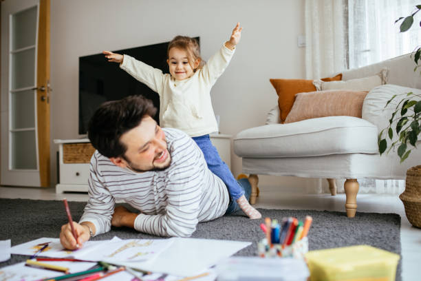istock Young dad have fun drawing with little daughter 1216044887