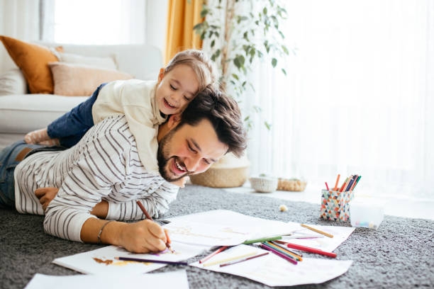istock Young dad have fun drawing with little daughter 1216045525