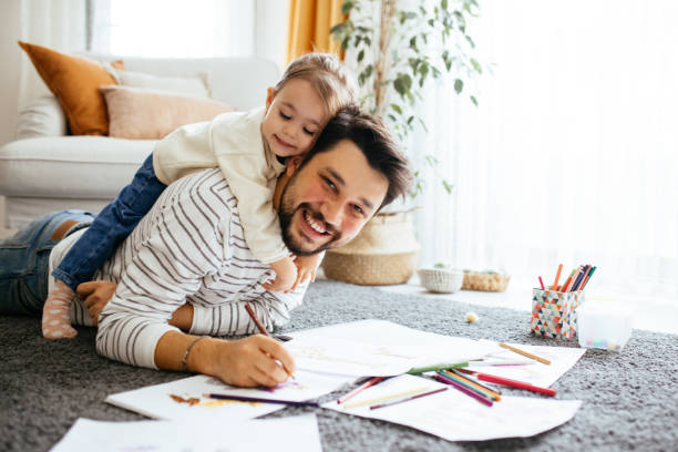 istock Young dad have fun drawing with little daughter 1216046939
