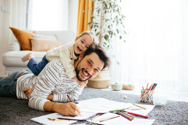 istock Young dad have fun drawing with little daughter 1216047918