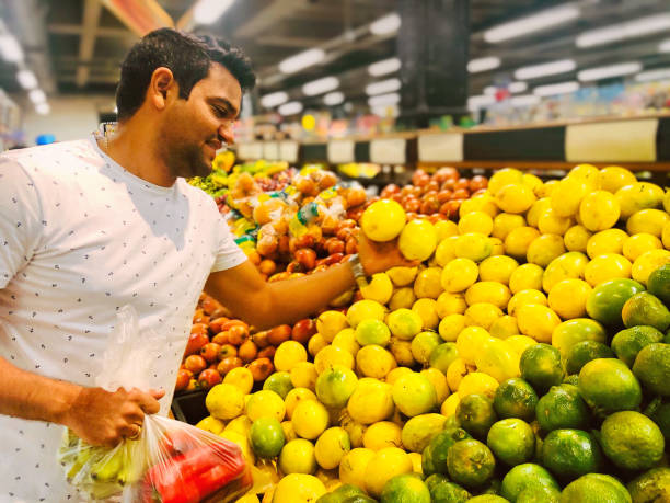 Man buying fruits in a supermarket
