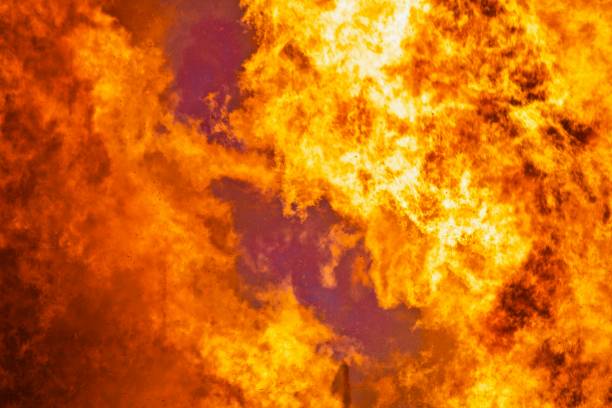 istock Firestorm close up. Raging flames of huge fire. 1216048274