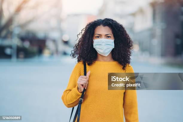 Young Woman With A Mask During Pandemic Stock Photo - Download Image Now - Protective Face Mask, Women, People