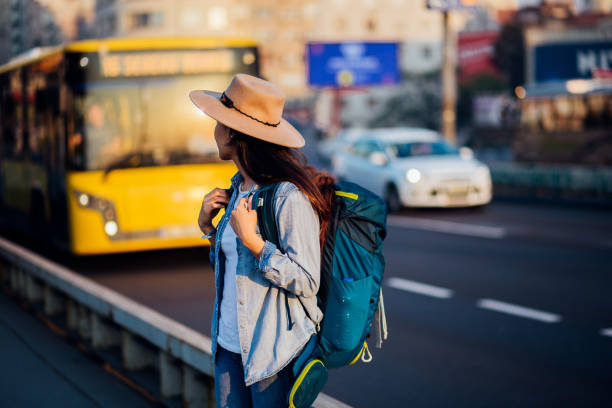 istock Brunette lady waiting for the tram 1216056336