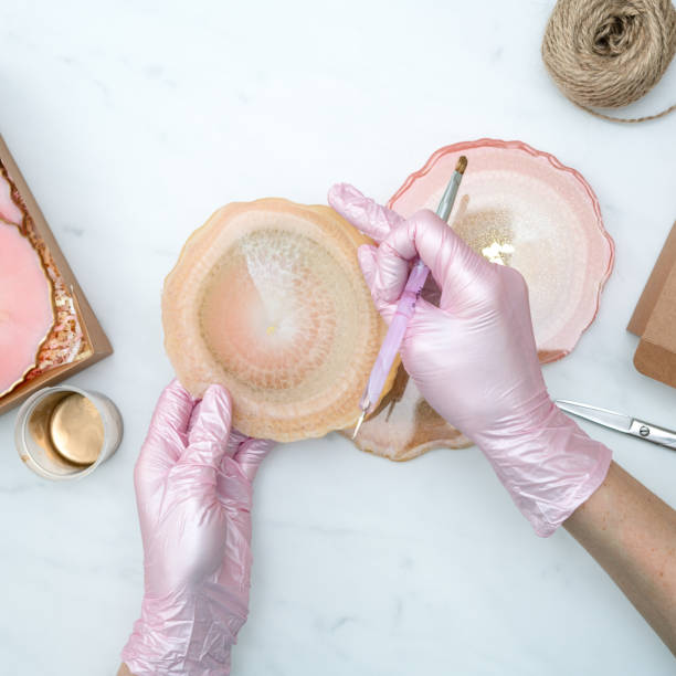 Creativity and craft. A young girl creates coasters from resin. Gift wrapping. Decorative packaging. Idea for business. Remote work, work at home. Art coasters.