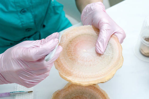 istock Creativity and craft. A young girl creates coasters from resin. Gift wrapping. Decorative packaging. Idea for business. Remote work, work at home. Art coasters. 1216056603