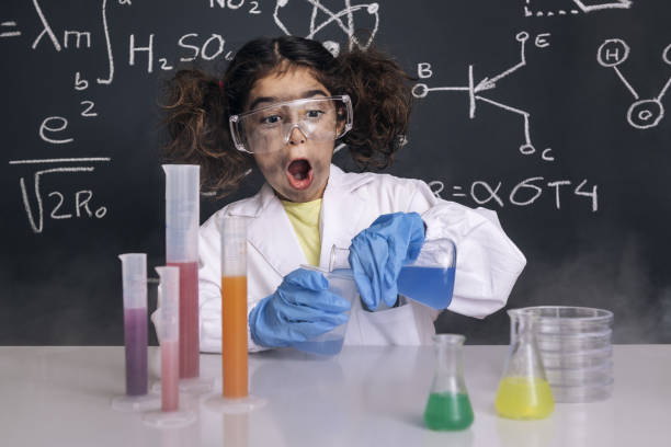 istock funny scientist girl mixing chemical flasks 1216057029