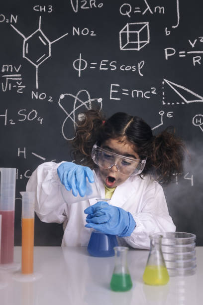 istock surprised scientist girl mixing chemical flasks 1216057635