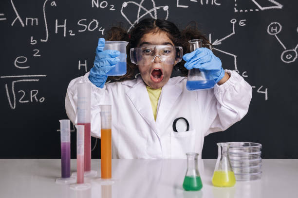 istock funny scientist child with goggles in lab coat 1216057927
