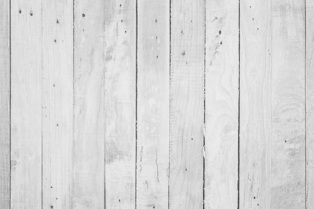 istock Wood plank white timber texture background. Old wooden wall all have antique cracking furniture painted weathered peeling wallpaper . Vintage table plywood woodwork hardwoods at summer for copy space. 1216058939