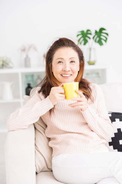 istock woman who drink coffee 1216065437