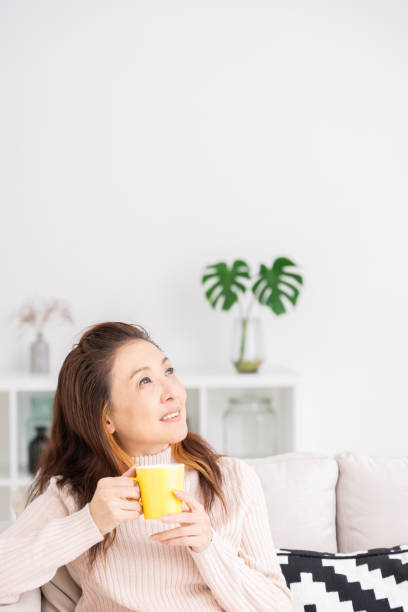 istock woman who drink coffee 1216065455