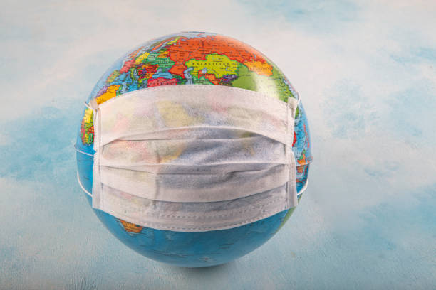 istock globe lies on a medical mask during a coronavirus on planet earth 1216066034