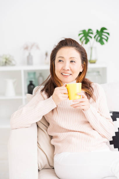 istock woman who drink coffee 1216066114