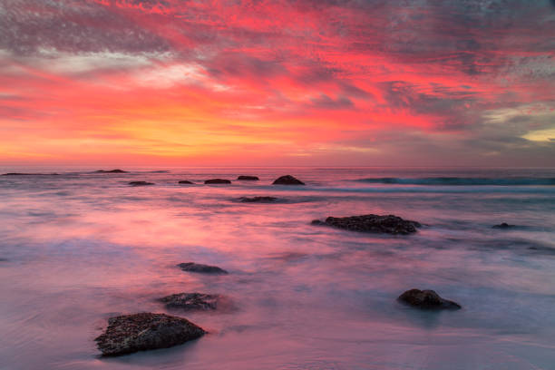 istock Dramatic Sunset over Rocky South African Beach 1216067198