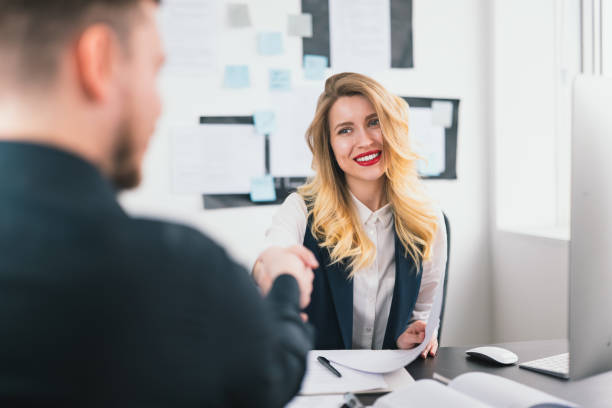 istock young woman hr manager shaking hands with candidate after successful interview in her modern bright office, , multitasking, employment concept 1216072822