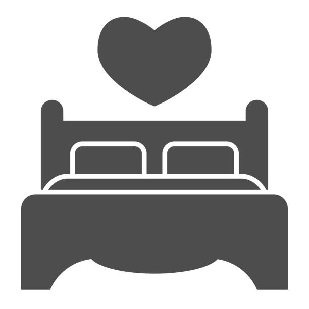 Double bed and pillows solid icon. Bedding furniture with heart shape symbol, glyph style pictogram on white background. Valentines day sign for mobile concept, web design. Vector graphics. Double bed and pillows solid icon. Bedding furniture with heart shape symbol, glyph style pictogram on white background. Valentines day sign for mobile concept, web design. Vector graphics bed furniture illustrations stock illustrations