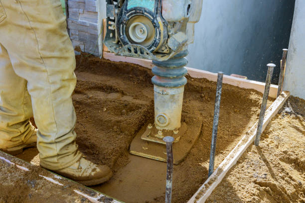 istock Vibratory hammer, jumping machine small plate compactor on urban sidewalk 1216076449