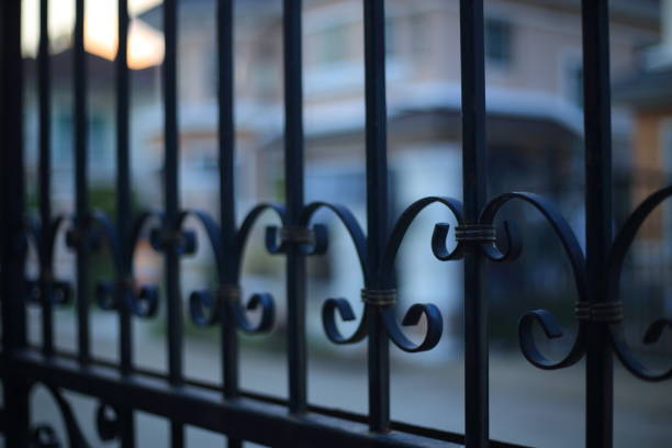 lock down, stay at home and business closed concepts. lock down, stay at home and business closed concepts. close up image of fence made of iron cast metal rods. fence3 stock pictures, royalty-free photos & images