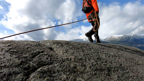 istock Mountaineer walks along mountain ridge 1216076634