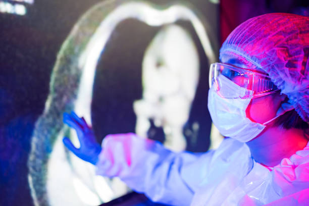 istock Doctor looking CT examination image in the virus lab 1216076697