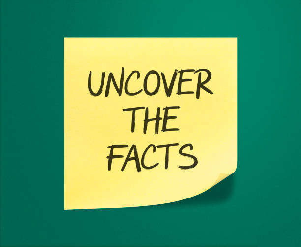 istock Uncover the Facts sticky note on green backgroud 1216076699