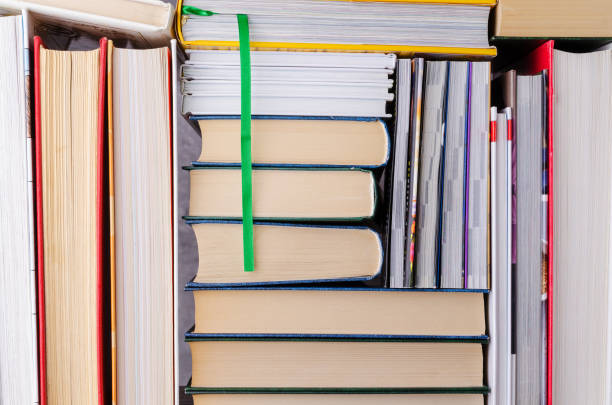 istock Closeup background of a stack of books. 1216076716