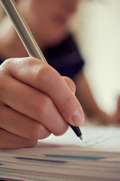 istock young woman writing pen notepad call 1216076732
