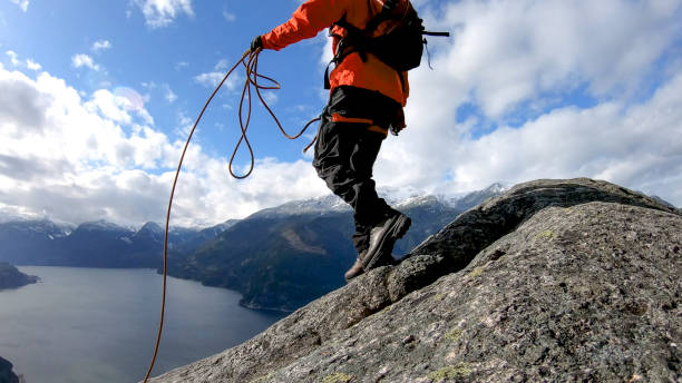 istock Mountaineer walks along mountain ridge 1216077430