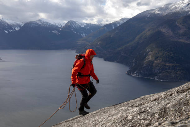 istock Mountaineer walks along mountain ridge 1216077457