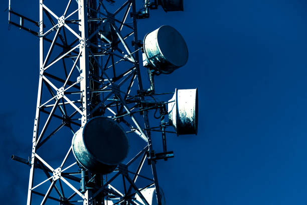 Telecommunication mast TV antennas wireless technology with blue Satellite Dish, Telecommunications Equipment, Antenna - Aerial, Computer Network, Internet launch tower stock pictures, royalty-free photos & images