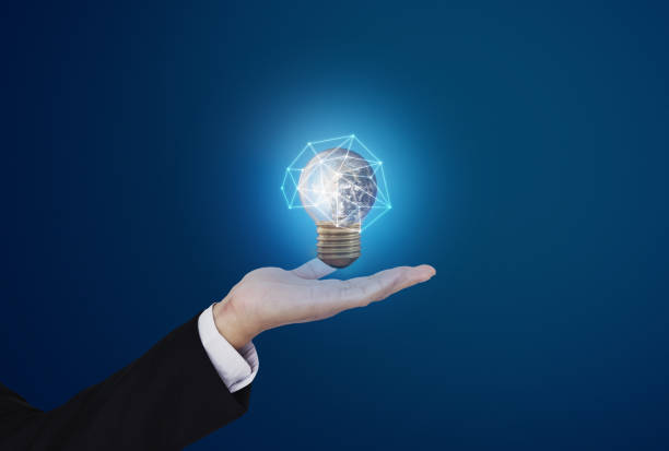istock Saving energy, and earth day concept. Businessman holding glowing earth light bulb. Element of this image are furnished by NASA ( https://svs.gsfc.nasa.gov/11650 ) 1216079842