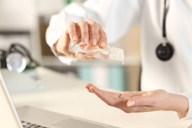 istock Doctor woman using hand sanitizer at the office 1216080910