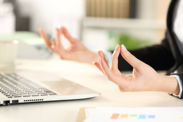 istock Executive hands relieving stress doing yoga at office 1216080925